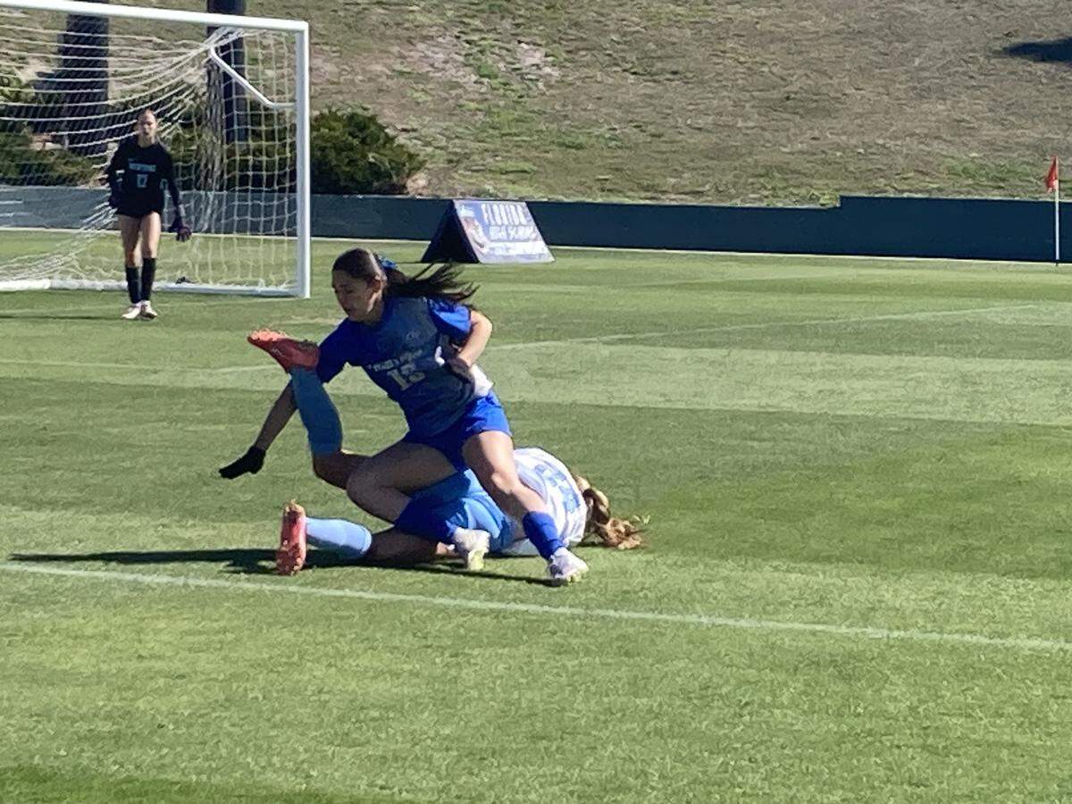 Cypress Bay’s Isabella Laboffe collides with a Newsome defender as she goes after a 50-50 ball during Tuesday's Class 7A state girls’ soccer semifinal at SpecMartin Stadium in DeLand, Fla.