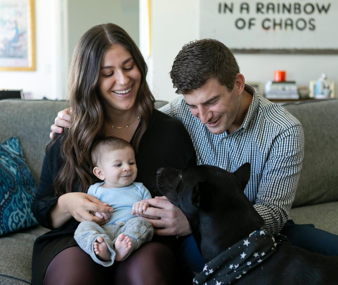 Emma Harris, 31, her husband, Jordan Mandel, 32, and her 11-week-old-son, Mason Mandel, live at their home in MiamiÕs Edgewater neighborhood on Friday, February 5, 2021. Since MasonÕs birth, both Emma and Jordan have been juggling between parenting and working from home as infant child care centers and in-home help are too expensive.