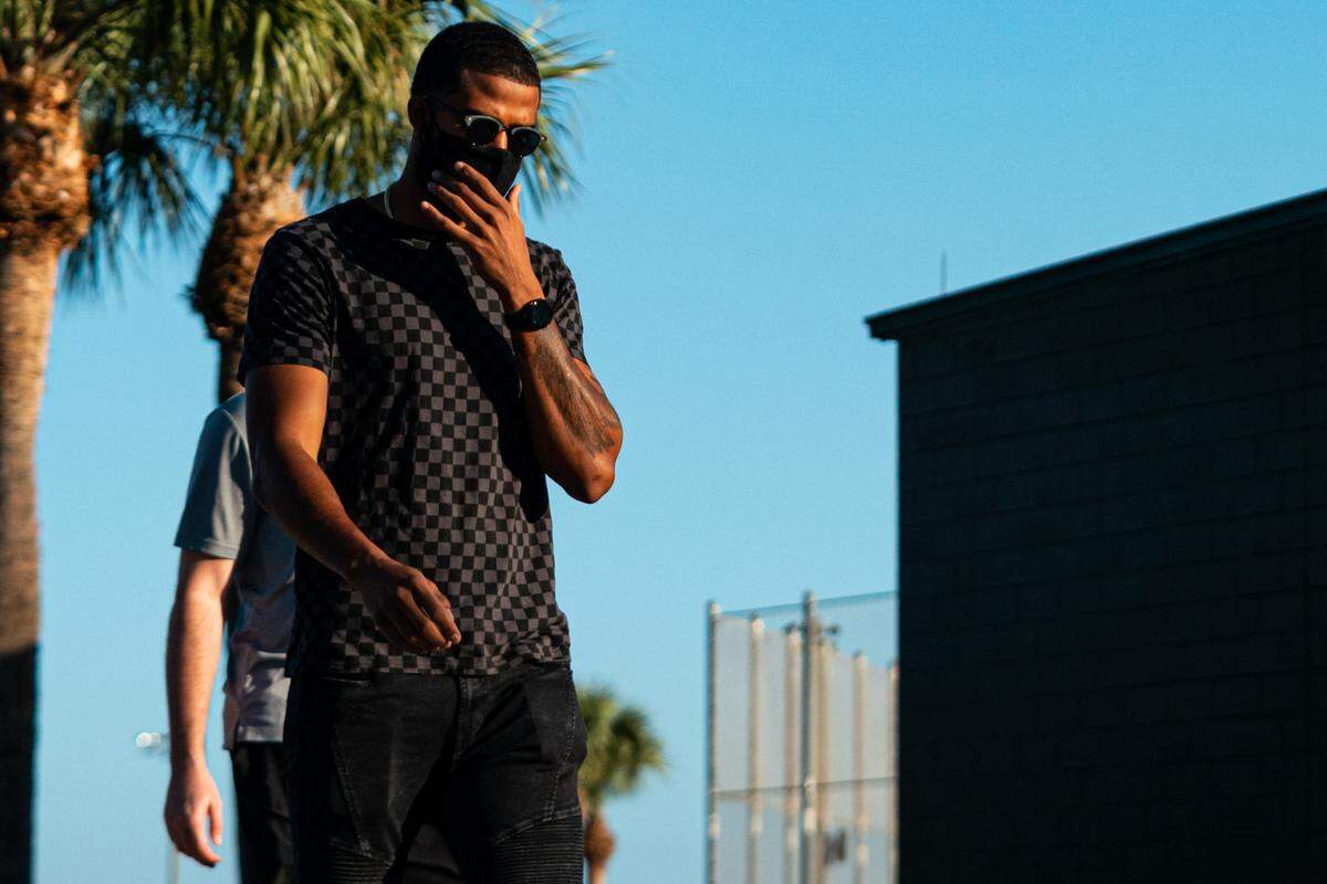 Miami Marlins pitcher Sandy Alcantara walks to the Roger Dean Chevrolet Stadium complex in Jupiter, Florida, for the first pitchers and catchers practice of spring training on Thursday, Feb. 18, 2021.