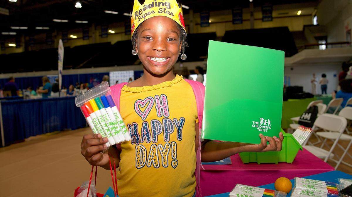 File photo from 2024 of a child getting school supplies at a Family Expo sponsored by The Children’s Trust.