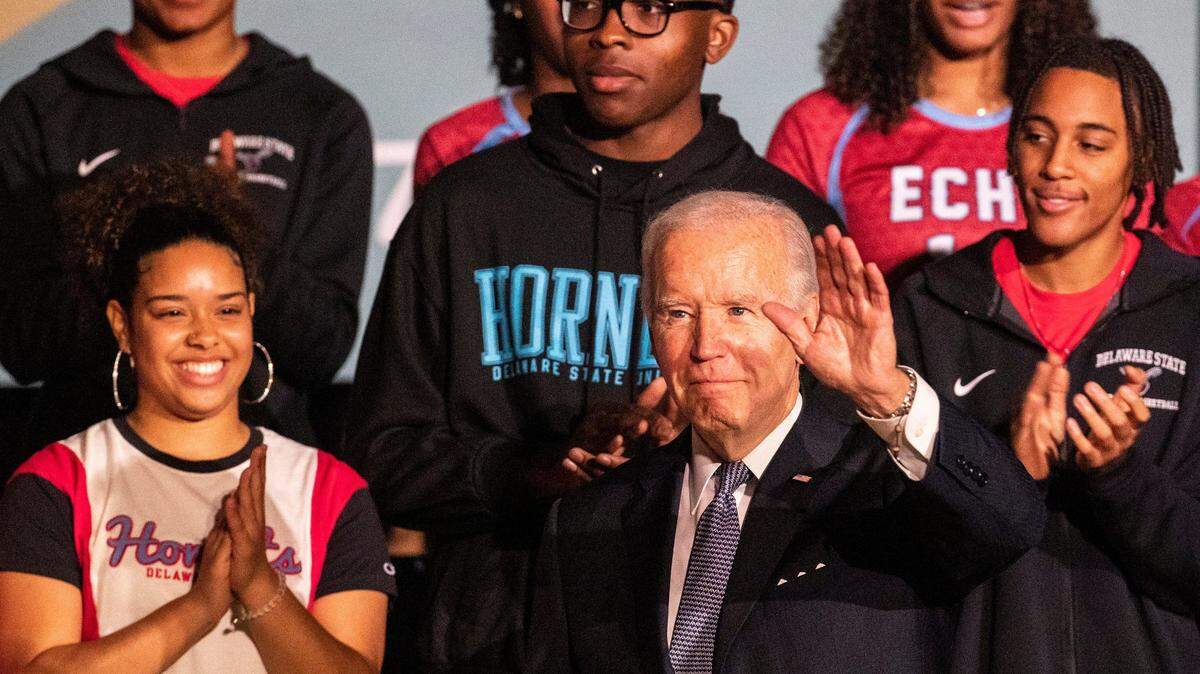 President Joe Biden takes photos with Delaware State University students after delivering remarks about student debt relief in Dover on Oct. 21, 2022.