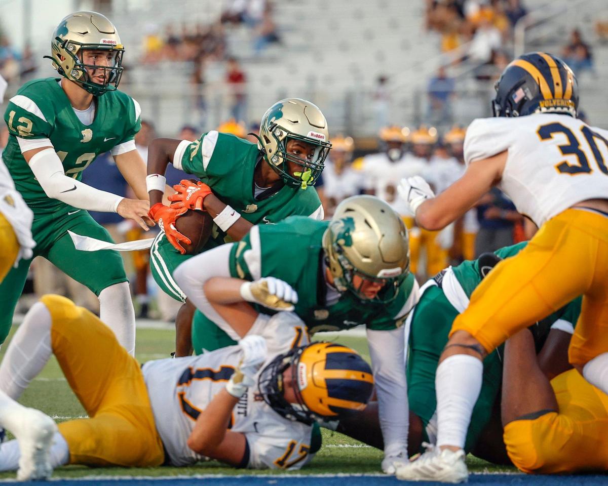 Immaculata-La Salle High School’s Torrance Jones (10) runs in to score against Belen Jesuit in the first quarter at Tropical Park Stadium in Miami, Florida, on Friday, September 6, 2024.