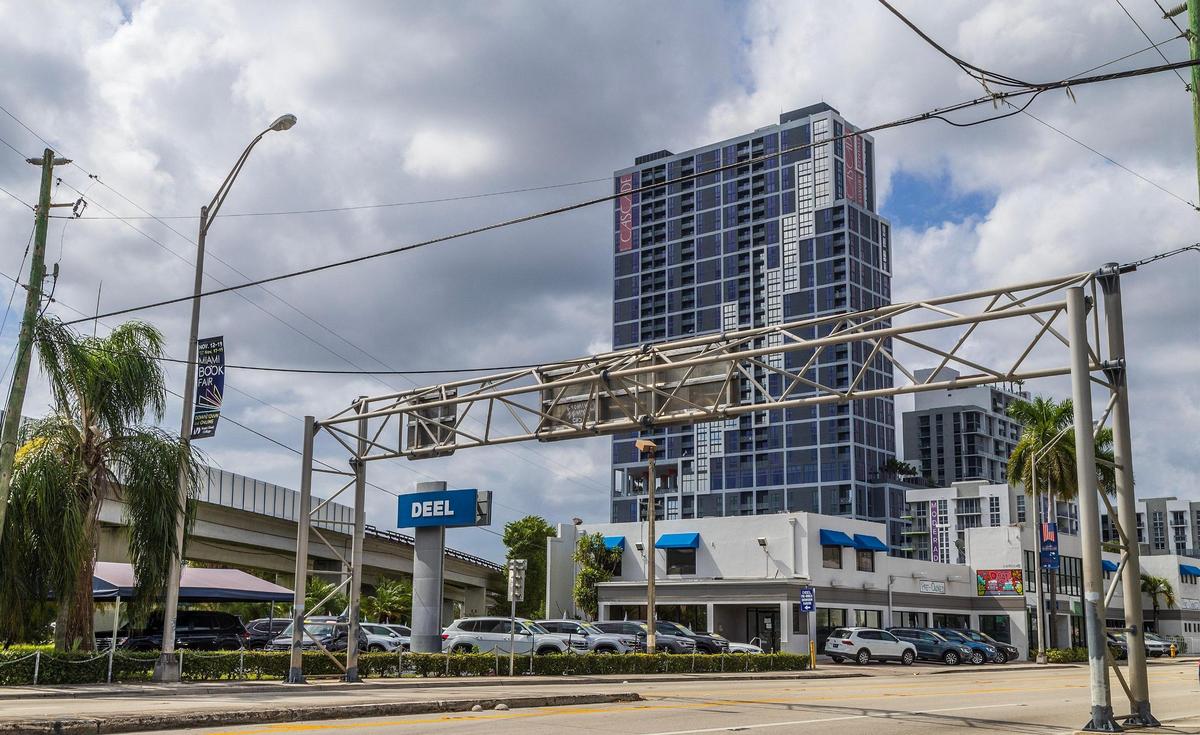 Developer Shoma Group released plans to build two 40-story apartment towers and a food hall on the Bird Road site near U.S. 1 that’s now home to a portion of the Deel Volkswagen dealership, a block from the Douglas Road Metrorail station. The 37-story Cascade at Link tower, built on station property, is visible in the background.