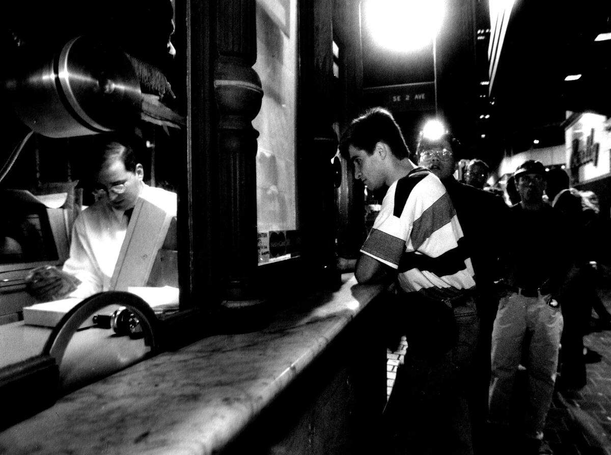 Enthusiastic movie-goers stand in line late Monday evening for tickets to a film sponsored by the 11th Annual Miami Film Festival at Gusman Theater of the Performing Arts in downtown Miami.