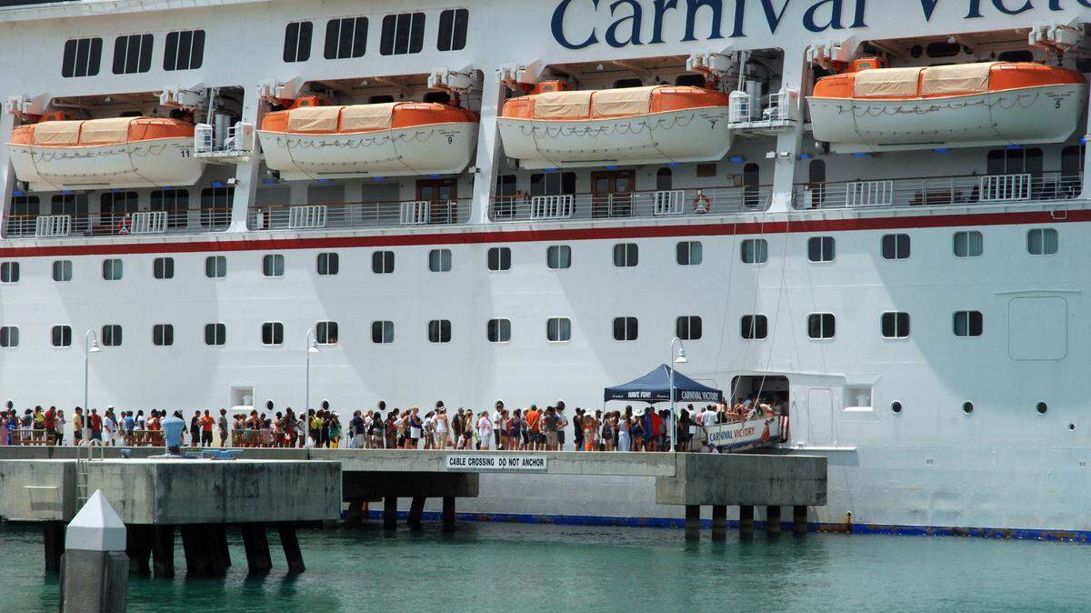 Cruise ships passengers return to the Carnival Victory after spending a few hours in Key West during a recent port call.