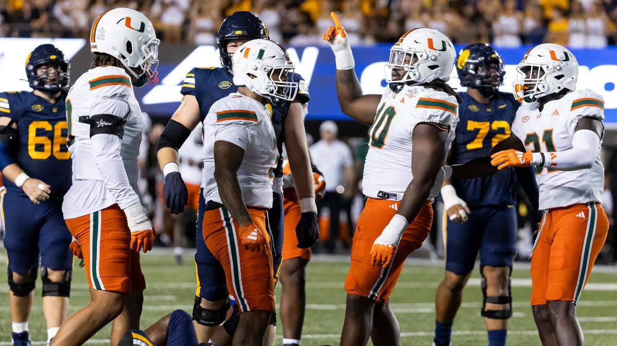 Miami Hurricanes defensive lineman Simeon Barrow Jr. (10) celebrates after tackling California Golden Bears running back Jaivian Thomas (25) in the second half of their NCAA college football game at the California Memorial Stadium on Saturday, Oct. 5, 2024, in Berkeley, Calif.