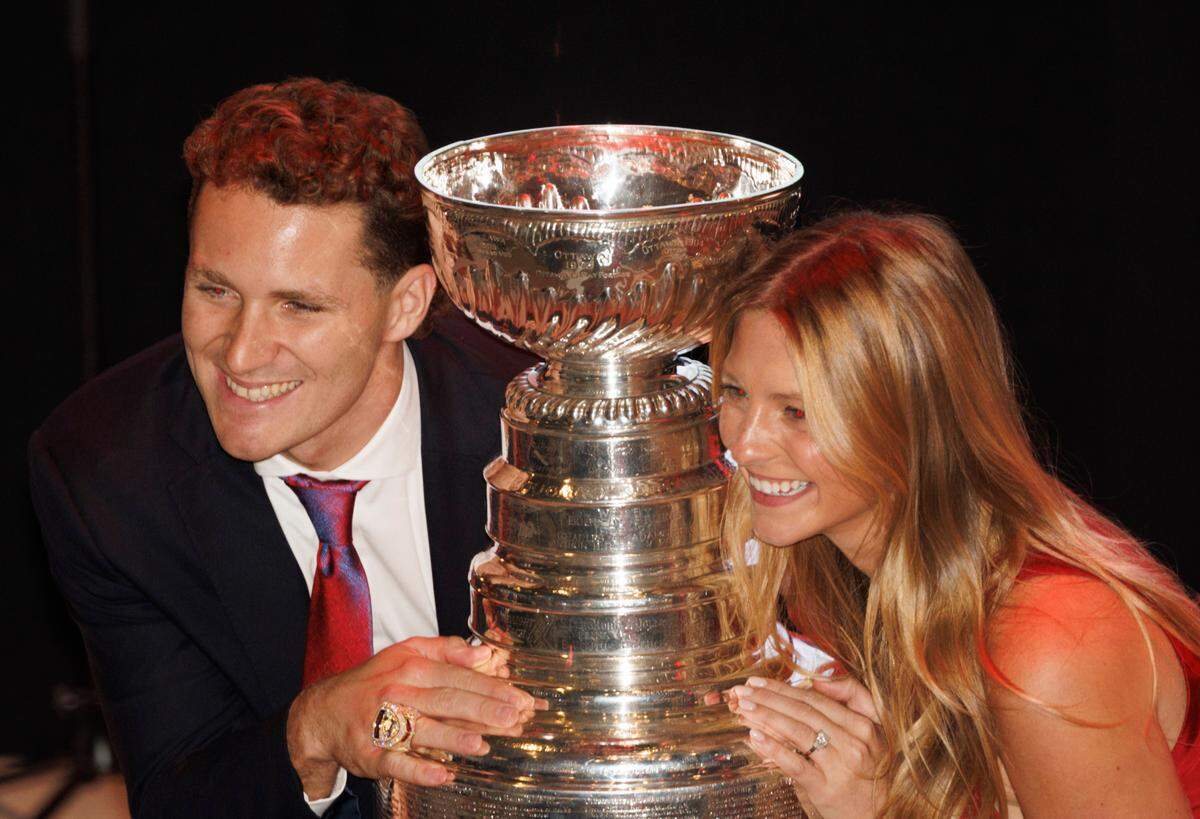 Matthew Tkachuk and his fiancé pose with the Stanley Cup during the Florida Panthers 2024 Champions Ring Ceremony on Monday, Oct. 7, 2024, at FTL War Memorial Auditorium in Fort Lauderdale, Fla.