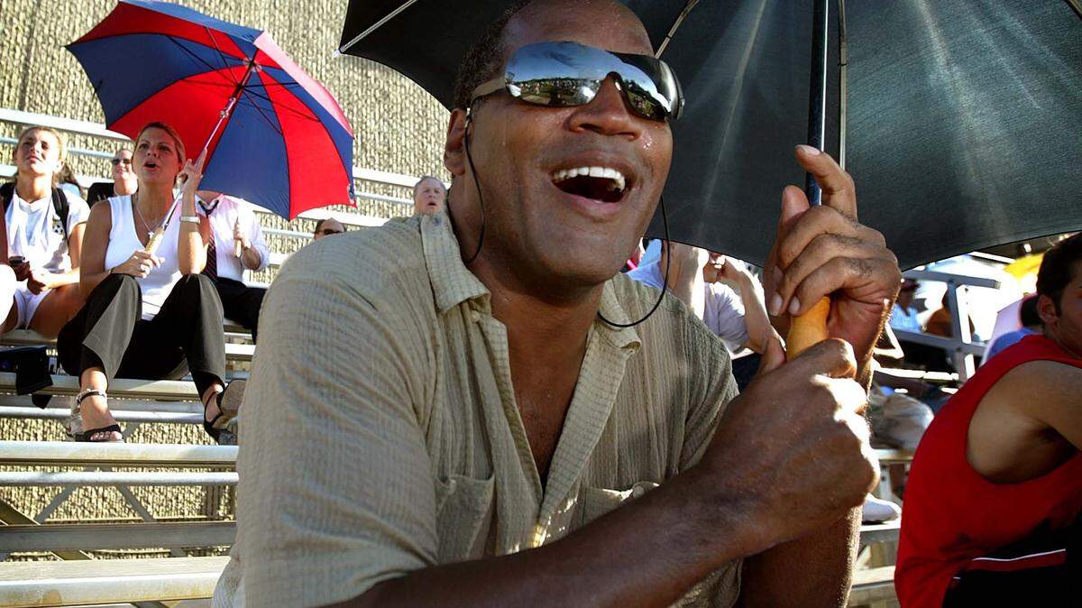 09/26/02 --Al Diaz/Miami Herald--Miami--In 2002, O.J. Simpson watches his son, No. 39 Justin Simpson, a ninth-grader at Gulliver Prep and JV football player.