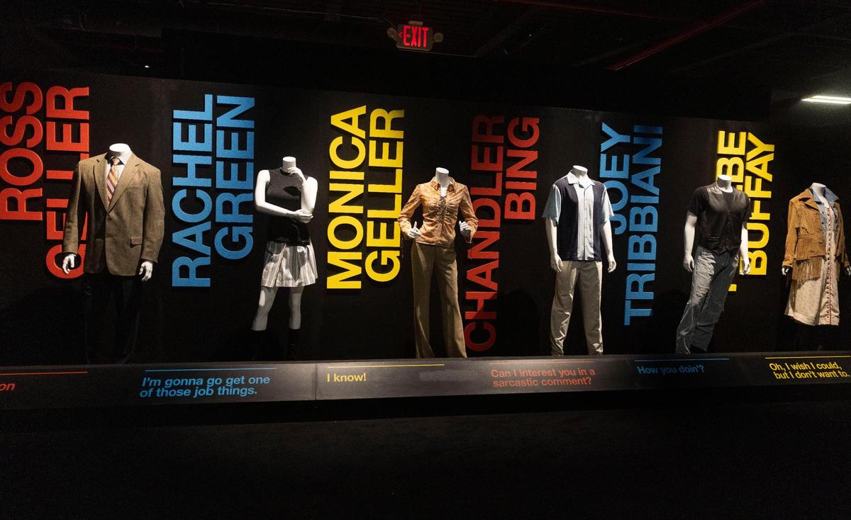 Outfits inspired by the six main characters of the television show Friends are displayed with memorable quotes at the Friends Experience.