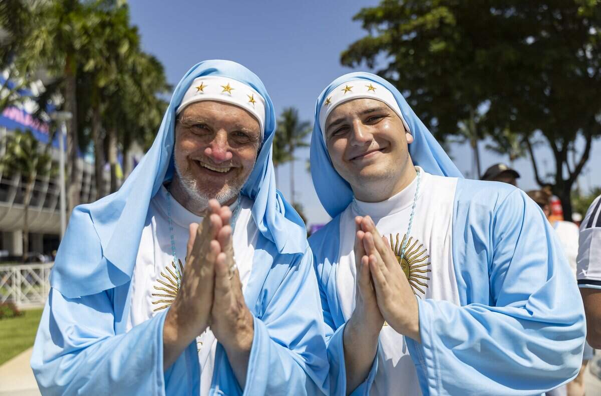 Argentina fans Daniel Buttazzoni, left, and his son, Santino Buttazzoni, dress as nuns as they arrive to the Hard Rock Stadium (Miami Stadium) for the FIFA World Cup 2026 Round of 32 soccer match against Cape Verde on Friday, July 3, 2026, in Miami Gardens, Fla.
