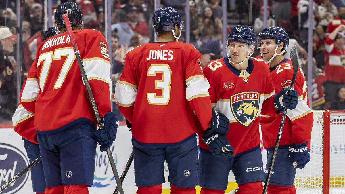 Florida Panthers center Sam Reinhart (13) celebrates with his teammates after scoring a goal against Dallas Stars in the second period of an NHL game at Amerant Bank Arena on Saturday, Nov. 1, 2025, in Sunrise, Fla.