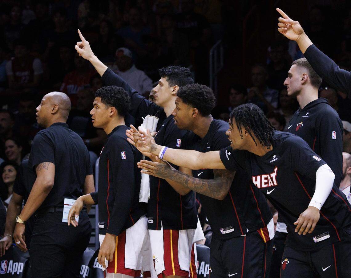 Miami Heat bench reacts to a call during the second half of a game against the Boston Celtics on Wednesday, April 1, 2026, at the Kaseya Center in downtown Miami, Fla.