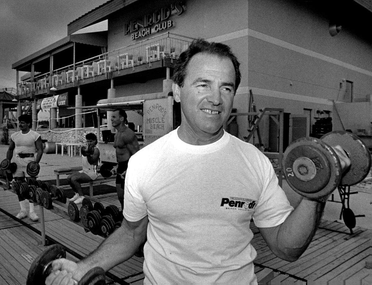 Jack Penrod, the late owner of Penrod's, works out on the weight at the gym behind his club.