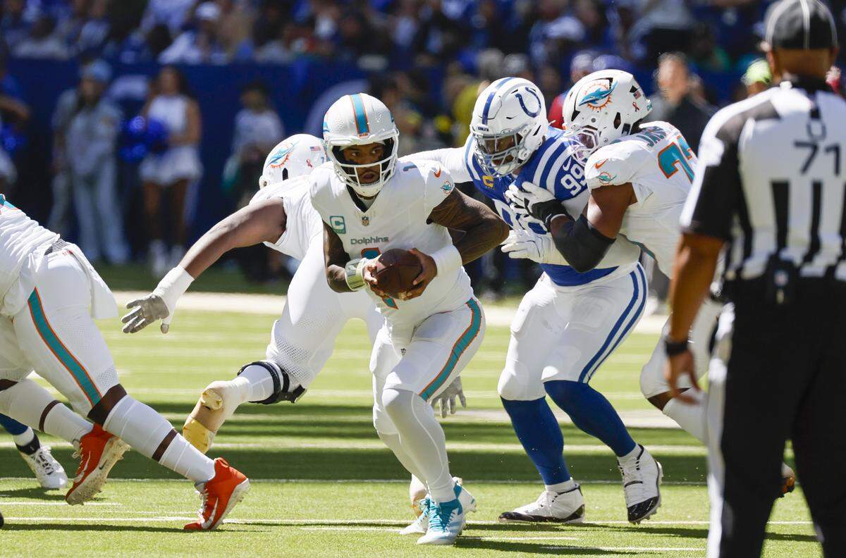Miami Dolphins quarterback Tua Tagovailoa (1) drops back to pass during the first half of an NFL game against the Indianapolis Colts at Lucas Oil Stadium on Sunday, September 7, 2025, Indianapolis, Indiana.