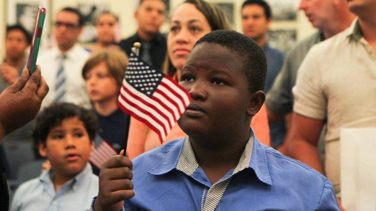 Sandro Laguerre, born in Haiti, celebrates after becoming a U.S. citizen during a naturalization ceremony in Miami in 2016.