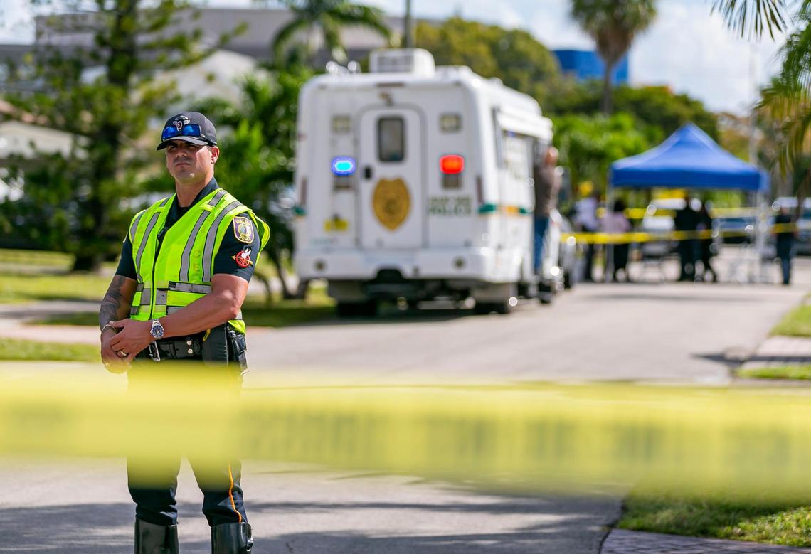 Police work a crime scene located near 1270 West 79th Street on Friday, Nov. 4, 2022, in Hialeah, Fla. Police say an off-duty Miami-Dade officer was shot by his ex-girlfriend during a domestic dispute Friday morning.