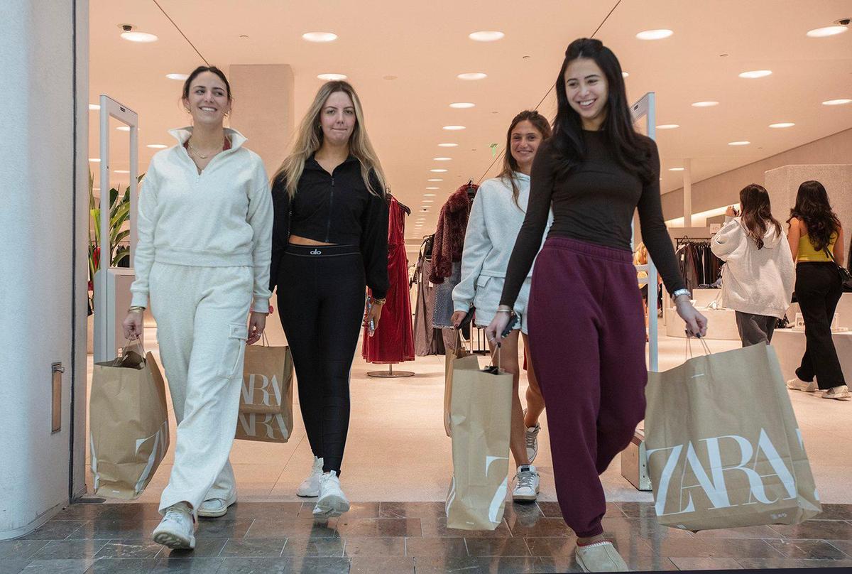 Zara customers (L to R) Sofia Alvarez, Natalie Carreño, Olivia Alvarez, and Siena Bosch shop at the clothing store during Black Friday at Dadeland Mall, on Friday, Nov. 29, 2024.