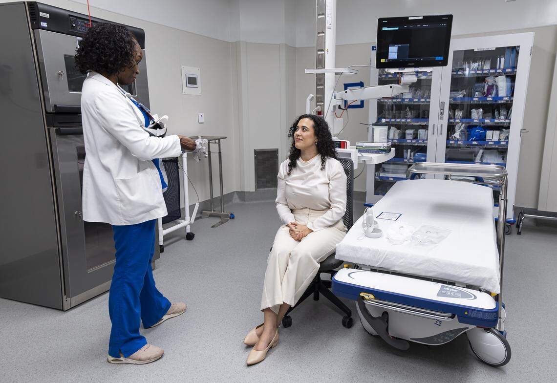 Sen. Alexis Calatayud, R-Miami, right, talks with Jahli Galloway, a clinical educator for Jackson Health, as she takes a tour of a new emergency room at Jackson Memorial Hospital on Thursday, April 16, 2026, in Miami, Fla.