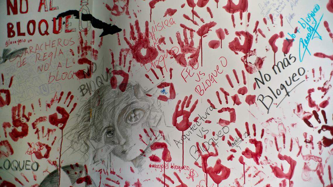 Handprints of students are seen on a wall during an event opposing the U.S. trade embargo against Cuba in Havana, Cuba, Wednesday, Oct. 31, 2018.