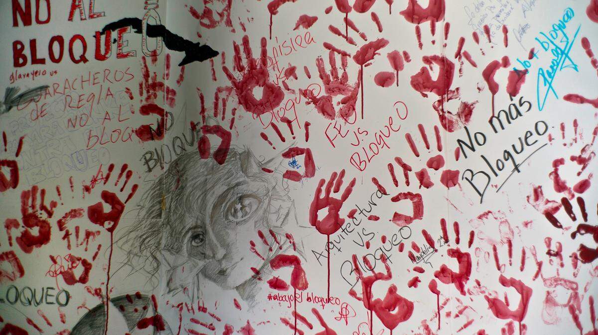 Handprints of students are seen on a wall during an event opposing the U.S. trade embargo against Cuba in Havana, Cuba, Wednesday, Oct. 31, 2018.