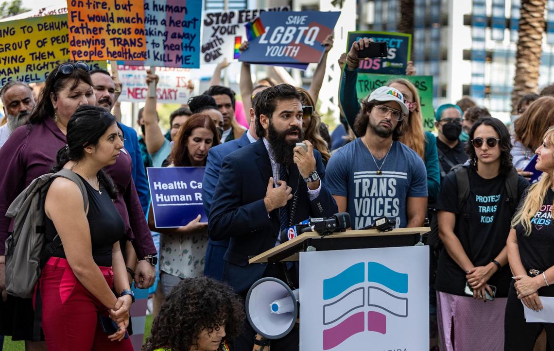 Kaleb Hobson-Garcia, a transgender man, drove from Tallahassee to speak during a press conference in front of the Marriott Fort Lauderdale Airport as the Florida Board of Medicine meets inside. On the agenda is a discussion of proposed rules by the DeSantis administration to ban doctors from performing gender-confirming surgeries or providing puberty blockers to kids diagnosed with gender dysphoria.