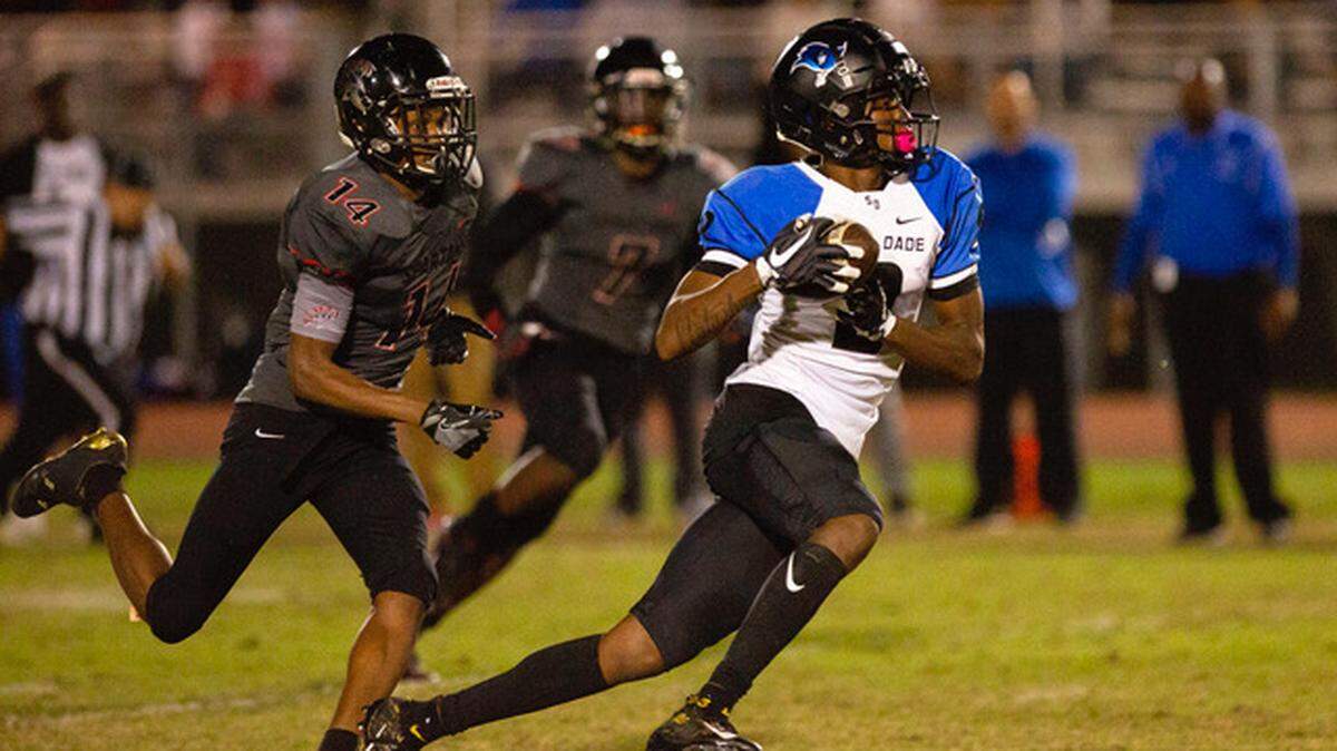 South Dade High School defensive back Jaiden Francois (2) runs past Miami South Ridge wide reciever Brad Springer (14) after making an interception during the third quarter of a footbal game at Southridge Park in Miami, FL, on Friday, November 16, 2018. 