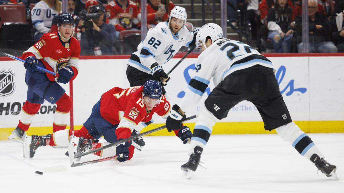 Florida Panthers center Anton Lundell (15) dives in front of Utah Mammoth center Jack McBain (22) during the second period of a game on Tuesday, Jan. 27, 2026, at Amerant Bank Arena in Sunrise, Fla.