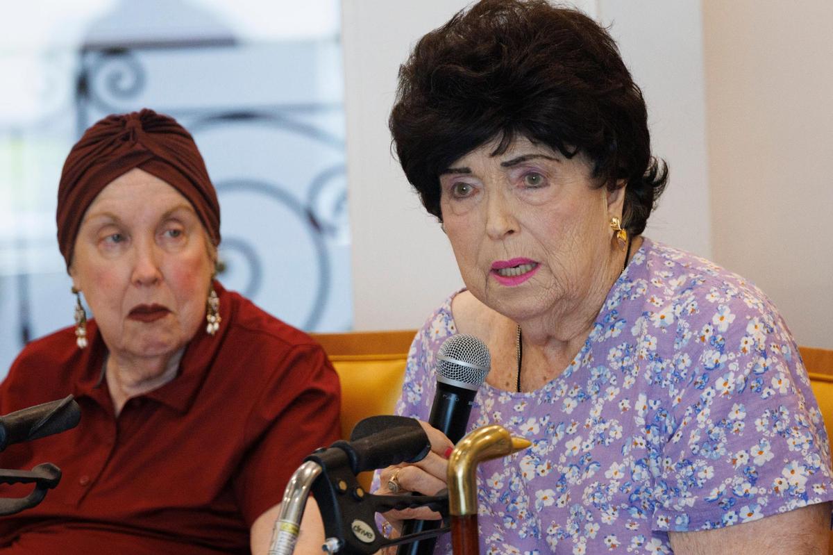 Veronica Fuchs, right, speaks about her view on religion and God while Jan Schneider listens during an Interfaith Conversation Series called “A Reverend and a Rabbi” at Vi at Aventura retirement community.