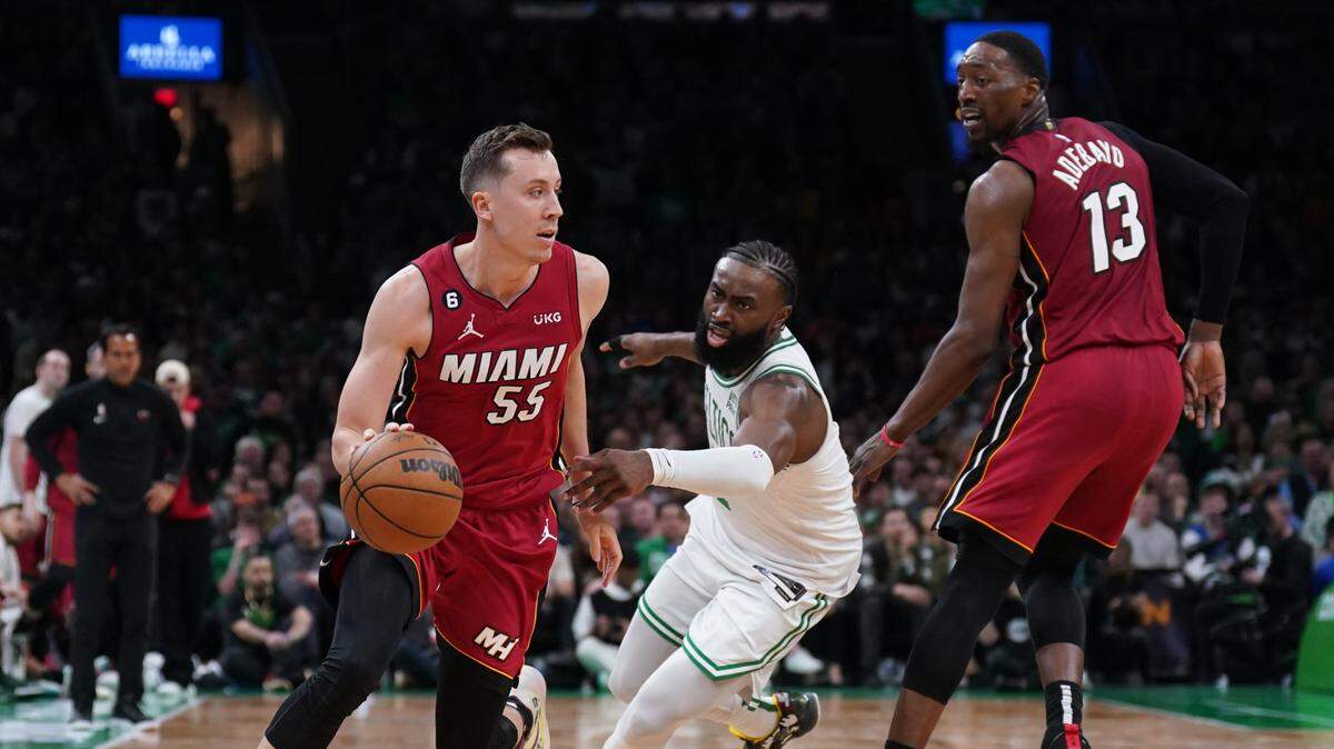 Miami Heat forward Duncan Robinson (55) drives past Boston Celtics guard Jaylen Brown (7) during the second half of game two of the Eastern Conference Finals for the 2023 NBA playoffs at TD Garden.
