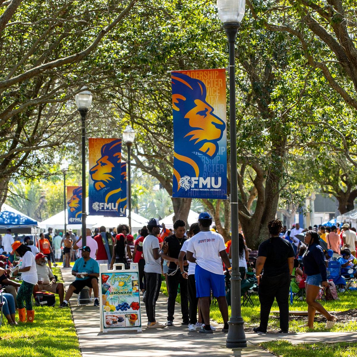 People walk around and socialize during the 6th Annual South Florida HBCU Picnic at Florida Memorial University in Miami Gardens, Florida, on Saturday, July 9, 2022.