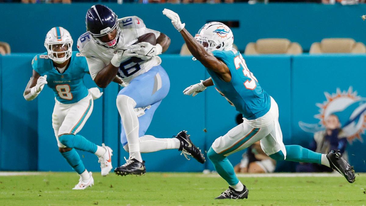 Tennessee Titans wide receiver Treylon Burks (16) on a pass reception as Miami Dolphins cornerback Storm Duck (36) and safety Jevon Holland (8) defend in the first half of their NFL game at Hard Rock Stadium on Monday, September 30, 2024, in Miami Gardens, Fla.