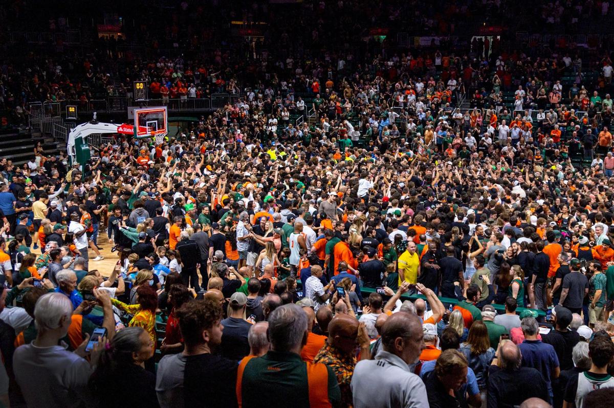 Fans rushed the court after the Hurricanes defeated the Pittsburgh Panthers 78-76 to become regular season Co-Champs and the first seed for the ACC Tournament during an NCAA basketball game at Watsco Center in Coral Gables, Florida, on Saturday, March 4, 2023.