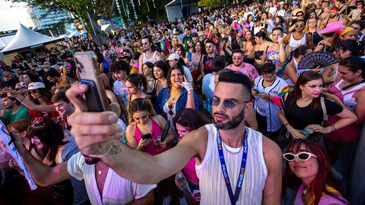 Festival goers crowd the Cosmic mainstage during Wynwood Pride music festival in Miami, Florida, on Saturday, June 11, 2022.