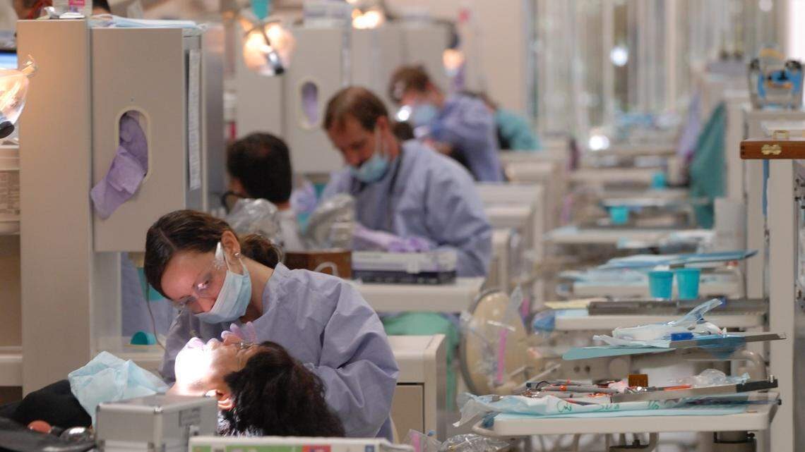 In this 2010 file photo, Nova Southeastern University College of Dental Medicine students work on patients at a clinic at 3200 S. University Drive. Dentists studying orthodontics at the clinics used dirty equipment for more than two years, NSU administrators said.
