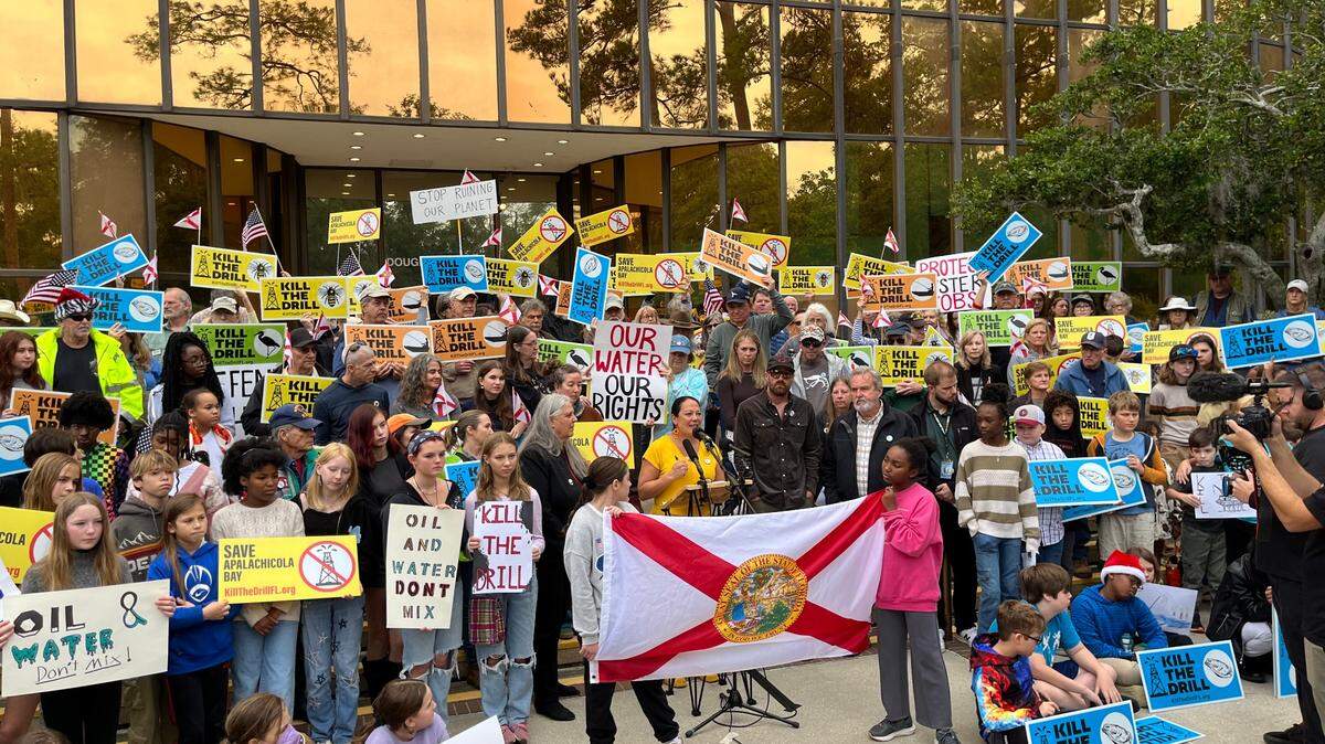 Xochitl Bervera, founder of the Apalachicola farm Water is Life Oysters, speaks to about 200 protesters outside the Florida Department of Environmental Protection’s headquarters in Tallahassee on Monday, Dec. 9, 2024.
