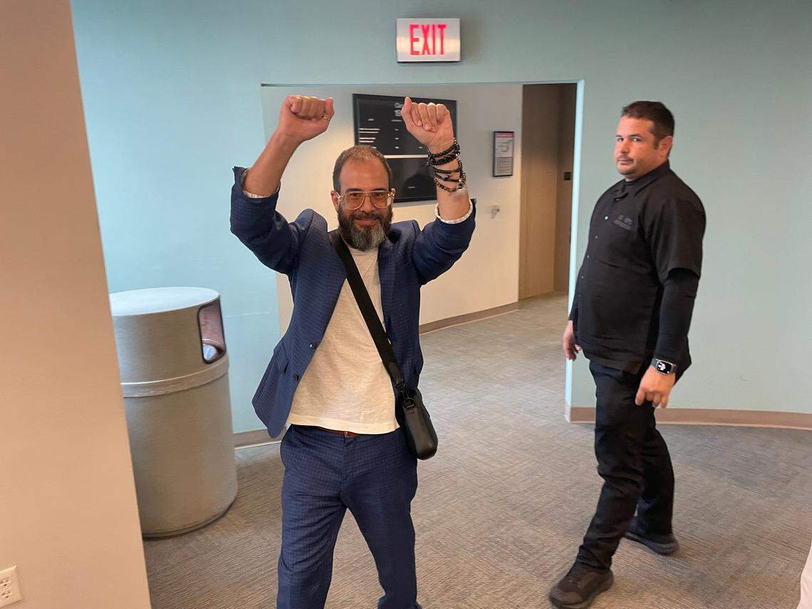 Alexander Otaola cheers to a small group of supporters outside a Miami-Dade courtroom after he was cleared in a stalking case on April 26, 2024. A judge ruled there was no evidence Otaola, a candidate for Miami-Dade County mayor, used his popular YouTube show to threaten or stalk the plaintiff, retired private investigator Joe Carrillo.