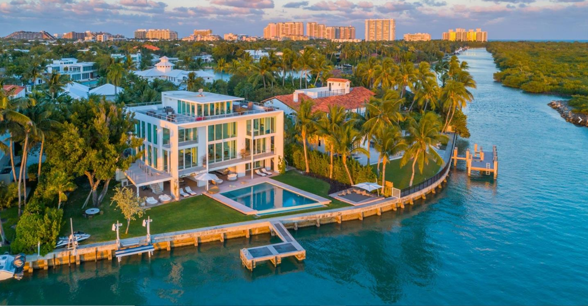 The 3-story Key Biscayne waterfront residence has an infinity pool, kids playroom, office, gym, staff quarters and dock.