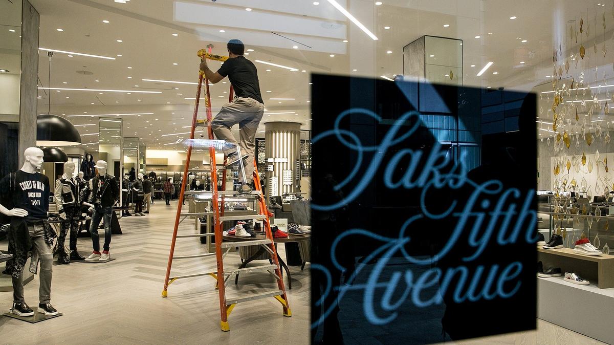 A worker hustles to get Saks Fifth Avenue store ready for its grand opening at the Brickell City Centre on Tuesday, Nov. 1, 2016. 