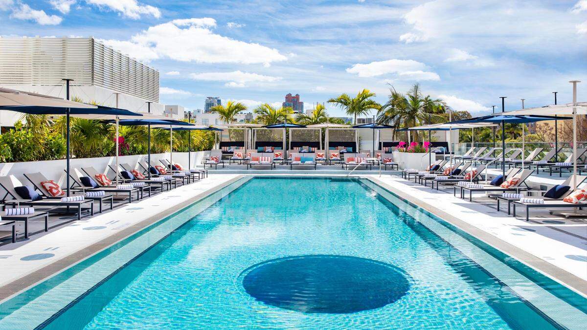 You can see the hotel lobby from a cutout in the second-floor pool at the Moxy South Beach.