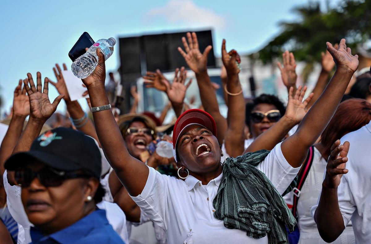 Members of Notre Dame d’Haiti Catholic Mission walk through the streets of Miami’s Little Haiti neighborhood in commemoration of the passion and Crucifixion of Jesus Christ on Good Friday, April 19, 2019.
