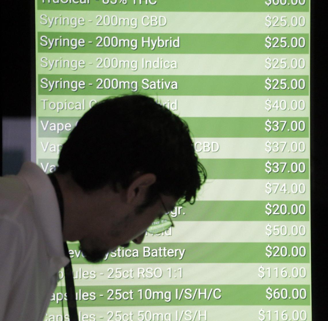 The menu at Trulieve, a dispensary at 4020 NW 26th St., provides a list of prices. No insurance plan covers the cost of medical marijuana.