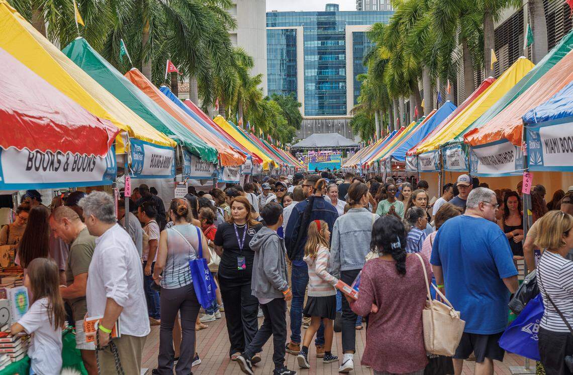 Literary lovers check out street booths during the Miami Book Fair’s 40th edition at Miami Dade College’s Wolfson Campus on Nov. 18, 2023.