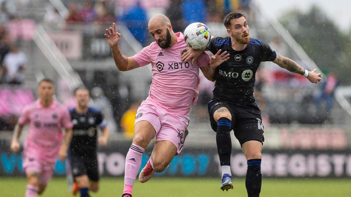 Inter Miami forward Gonzalo Higuaín (10) fights for possession of the ball against CF Montreal defender Joel Waterman (16) during the first half of an MLS soccer match at DRV PNK Stadium on Sunday, Oct. 9, 2022, in Fort Lauderdale, Fla.