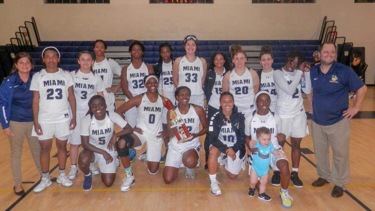 The Miami High Stingarees girls basketball team poses with the GMAC championship trophy after defeating Norland on Thursday, Jan. 31, 2019.