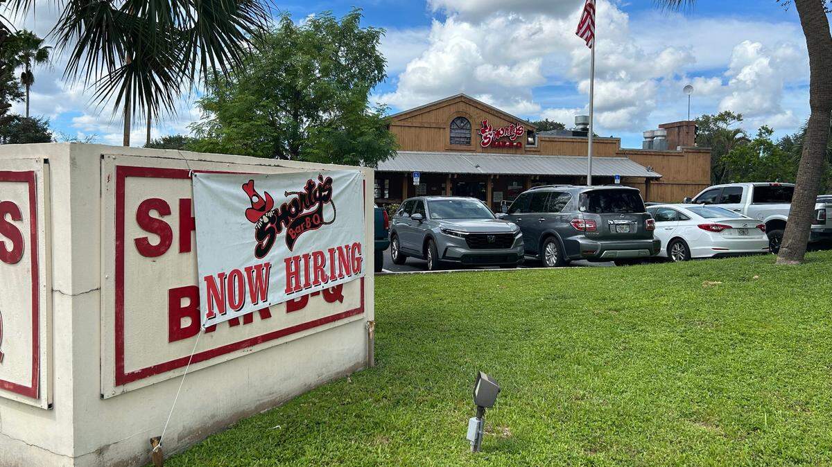 South Florida’s popular Shorty’s restaurant has its hiring needs on display at the corner of Stirling Road and University Drive in Davie on Friday, Oct. 6, 2023.