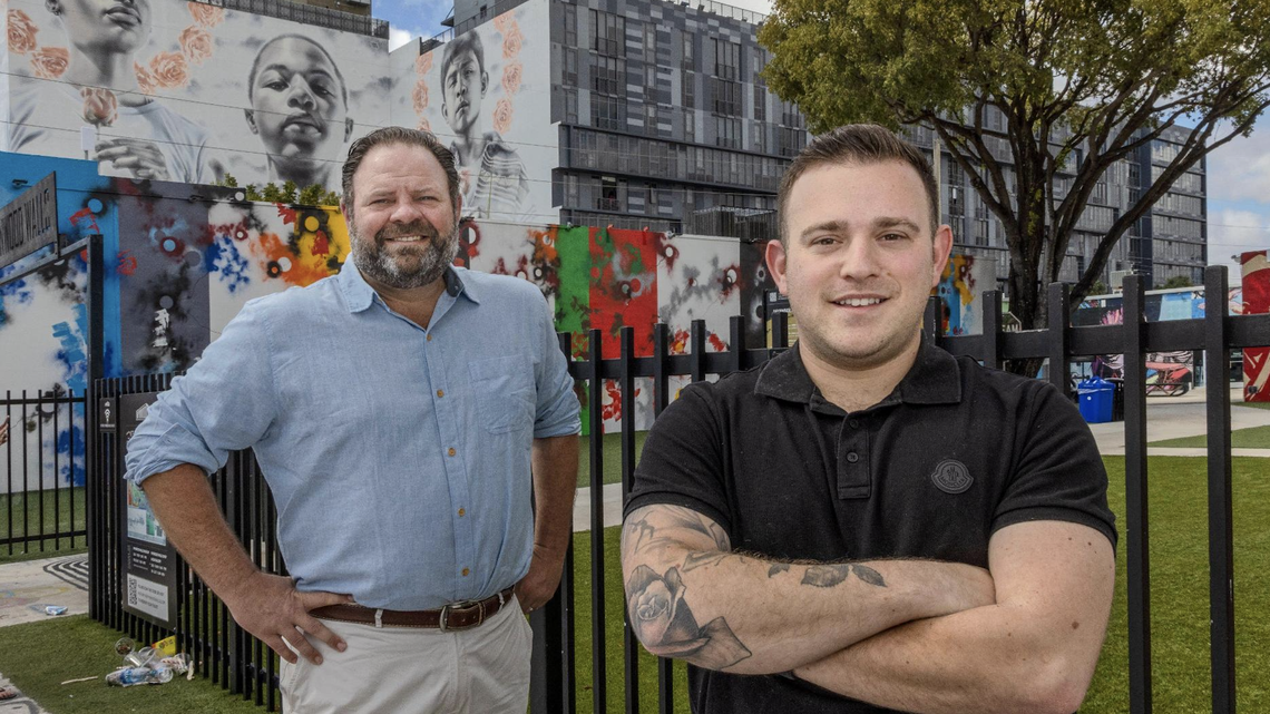 Glenn Gilmore, left, and Jesse Feldman of Brick and Timber Collective stand in front of their newly acquired Wynwood Annex office building in the popular arts district.