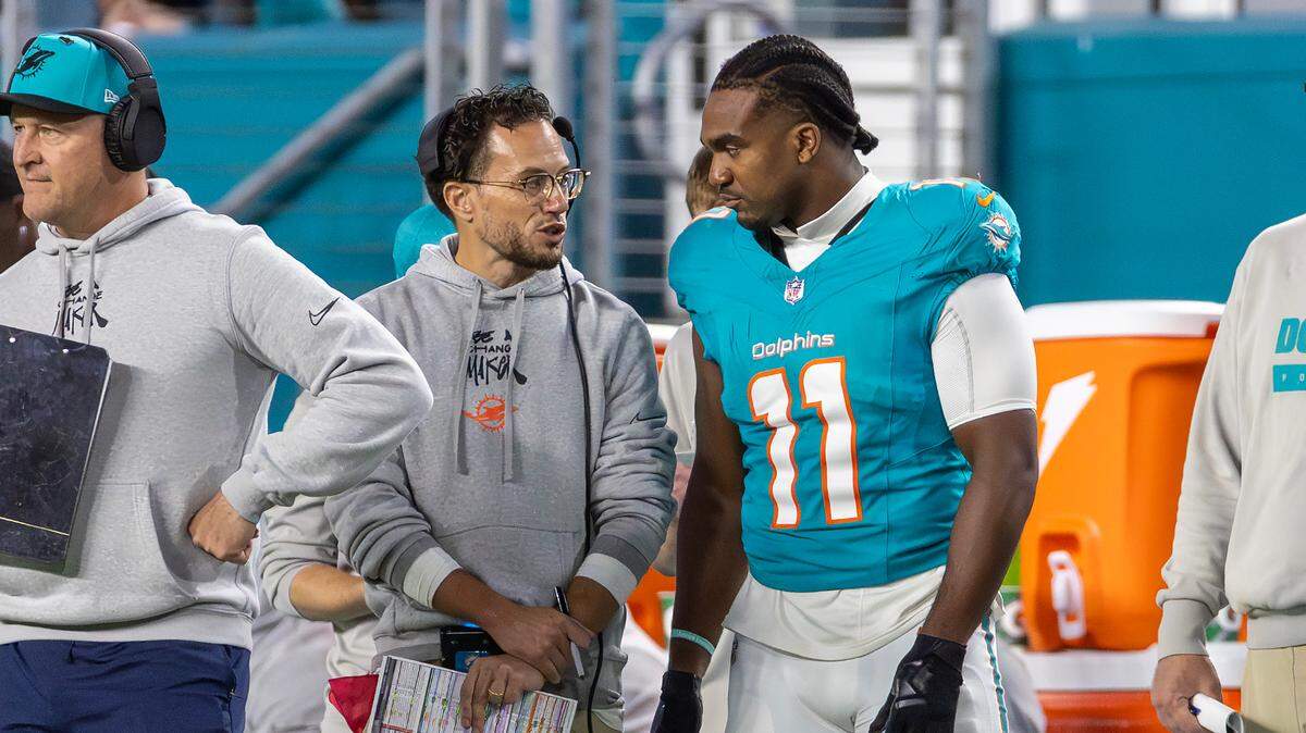 Miami Dolphins head coach Mike McDaniel speaks with linebacker Tyrel Dodson (11) on the sidelines during the second half of an NFL game against the San Francisco 49ers at Hard Rock Stadium on Sunday, Dec. 22, 2024, in Miami Gardens, Florida.