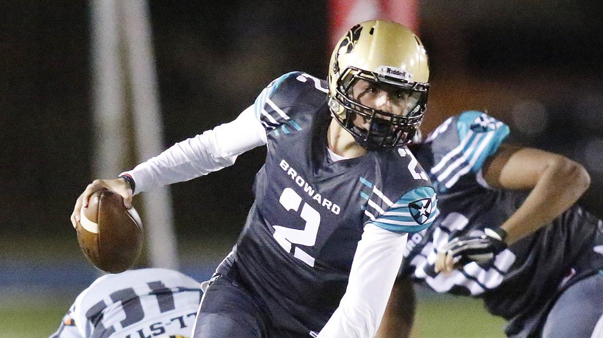 Broward’s quarterback Jesse Rivera (2) runs the ball against Miami Dade during the All-Star high school football game on Friday, January 11, 2019 at Traz Powell stadium in Miami
