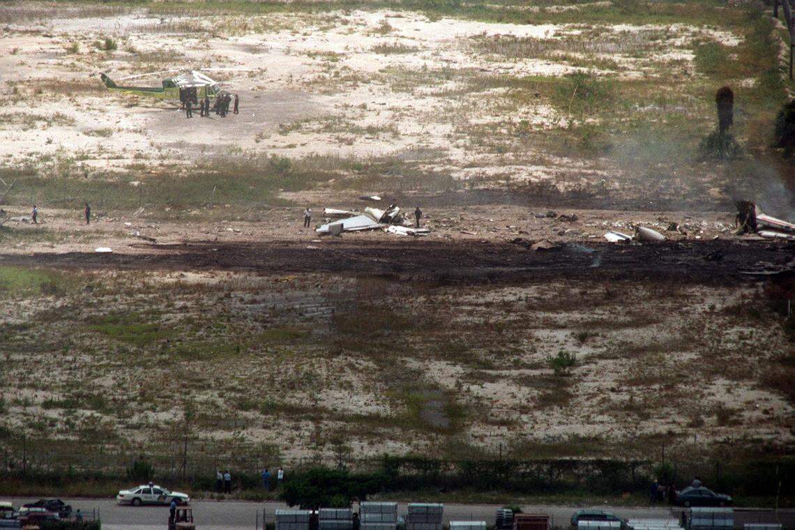 Pieces of the Fine Air Cargo plane that crashed on take-off from MIA. The skid marks cross this vacant lot.