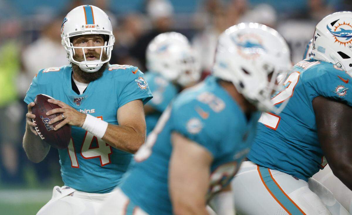 Miami Dolphins quarterback Ryan Fitzpatrick (14) looks to pass in the first quarter as the Miami Dolphins host the Jacksonville Jaguars at Hard Rock Stadium on Thursday, August 22, 2019.